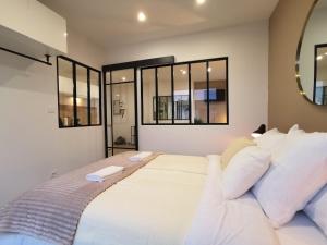Ένα ή περισσότερα κρεβάτια σε δωμάτιο στο Appartement T2 Cocooning, Secteur Doutre