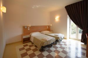 Postel nebo postele na pokoji v ubytování Domus Stella Maris - Casa per Ferie