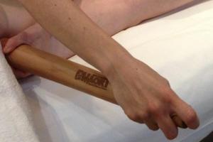 a person holding a baseball bat on a bed at B&B Cà d'Artisti in Caorle