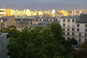 a view of a city with buildings and trees at Penthouse champs elysées above 5 stars hotel berri champs elysées in Paris