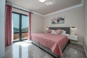 Postel nebo postele na pokoji v ubytování Apartments MaKris No1