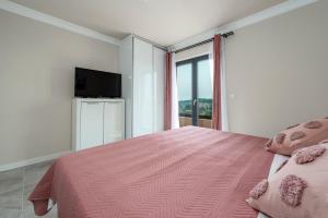 Postel nebo postele na pokoji v ubytování Apartments MaKris No1