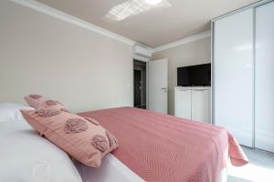 Postel nebo postele na pokoji v ubytování Apartments MaKris No1
