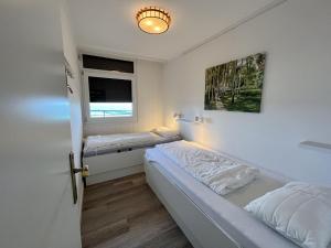 Postel nebo postele na pokoji v ubytování Strandhotel - 56
