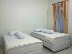 Postel nebo postele na pokoji v ubytování Villa Taribandung