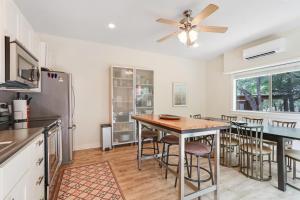 a kitchen with a table and a ceiling fan at Three Sisters - Casita 3 in Wimberley