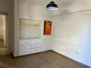 a room with white cabinets and a painting on the wall at Luxury 3 bedroom apartment in Nicosia City Center in Nicosia