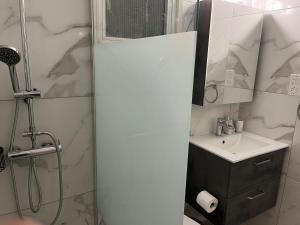 a bathroom with a shower and a sink at Luxury 3 bedroom apartment in Nicosia City Center in Nicosia