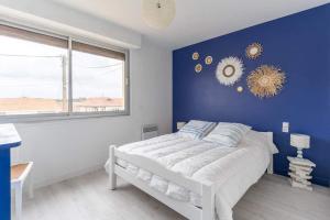 Postel nebo postele na pokoji v ubytování Maison Mimizan plage