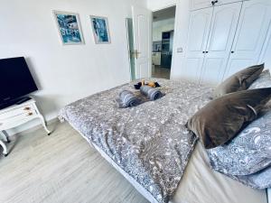Łóżko lub łóżka w pokoju w obiekcie Panorama Ocean View Gigantes