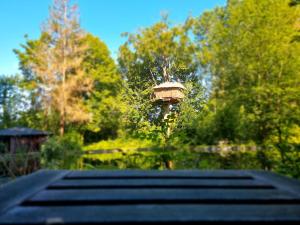 a bird house sitting on top of a bridge at Le Domaine de Wail Legends Resort in Wail