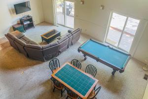 an overhead view of a living room with a pool table at Streiff Lake House in Bass Lake