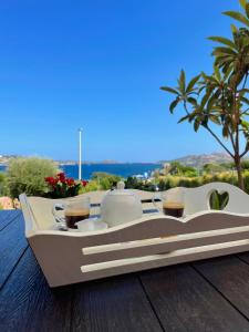 a tray with two cups of coffee on a table at Blumarine in Palau +26 photos
