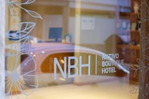Postel nebo postele na pokoji v ubytování NBH Nativo Boutique Hotel