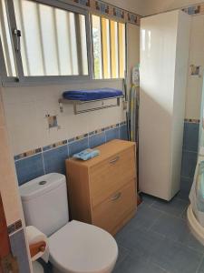 a small bathroom with a toilet and a sink at Playa del Ingles Estudio LOS MOLINOS 205 in Maspalomas