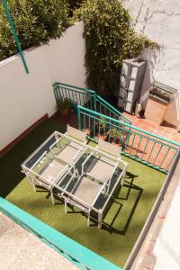 an overhead view of a table and chairs on a lawn at Cozy house near to the city center of Granada in Granada