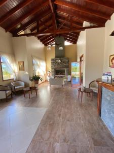 a large living room with a stone fireplace at Piedra de Agua in Federación