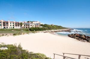 a view of a beach with houses and the ocean at ShipsBell 5B in St Francis Bay