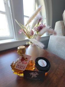 a table with a vase with flowers on it at The Hidden Inn in South Kortright