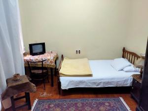 Postel nebo postele na pokoji v ubytování Triomphe Hostel