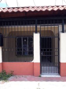 a building with a gate in front of a building at Apartamento AMUEBLADO in Canoas