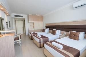 Postel nebo postele na pokoji v ubytování Hotel Caprea