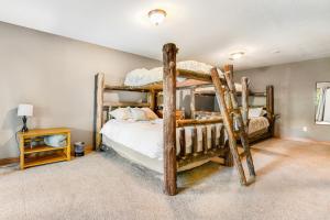 a bedroom with two bunk beds in a room at Aces and Eights Lodge in Sturgis