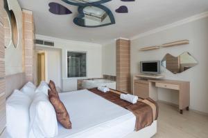 Postel nebo postele na pokoji v ubytování Hotel Caprea