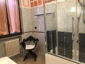 a bathroom with a shower with a glass door at B&B San Giorgio in Traversetolo