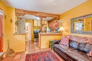 a living room with a couch and a kitchen at Casita Antonio in Taos