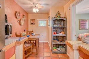 a kitchen with a table and a dining room at Casita Antonio in Taos