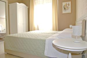 A bed or beds in a room at B&B Brindesi