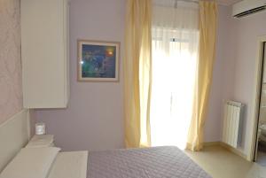 A bed or beds in a room at B&B Brindesi