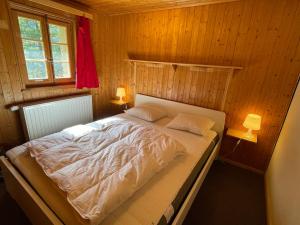 Letto o letti in una camera di Chalet Singlinaz