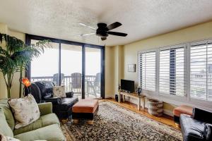 a living room with a couch and a ceiling fan at Wellington 304 in Myrtle Beach
