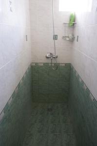 Kylpyhuone majoituspaikassa Guest House Pepeliana