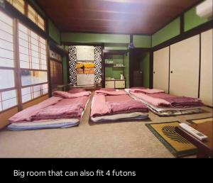 a large room with two beds in it at Da Fern in Sakaiminato