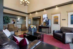 a living room with a couch and a table at Best Western Plus Kamloops Hotel in Kamloops