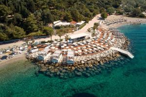 an aerial view of a beach with umbrellas and the water at Radisson Blu Resort & Spa in Split