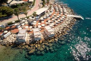 an aerial view of a beach with umbrellas and the water at Radisson Blu Resort & Spa in Split