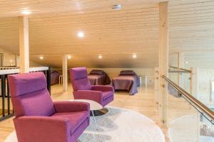 Posezení v ubytování Mustikkakallio Luxury Villa