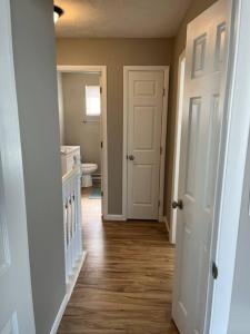 a hallway of a home with a toilet and a bathroom at Carter #4 Two bedroom unit near Xavier Downtown in Cincinnati