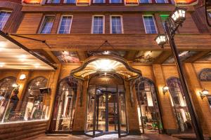 a building with an entrance to a store at Raymar Hotels Ankara in Ankara