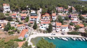 an aerial view of a village with boats in the water at Apartment Basina 11923a in Vrbanj +20 photos