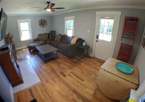 a living room with a couch and a table at Harper Two Bedroom House in Historic Loveland in Loveland
