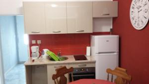 a kitchen with a sink and a refrigerator at Apartments by the sea Povlja, Brac - 12362 in Povlja