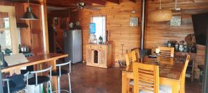 a kitchen and dining room with a table and chairs at Ensueño de Rapel , Costa del Sol in La Estrella