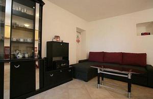 a living room with a couch and a table at Family friendly house with a parking space Presika, Labin - 12472 in Labin