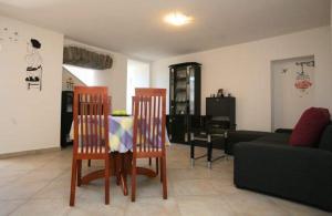 a living room with two chairs and a couch at Family friendly house with a parking space Presika, Labin - 12472 in Labin