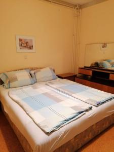 a large bed in a room with a mirror at Apartments and rooms by the sea Kampor, Rab - 12473 in Rab